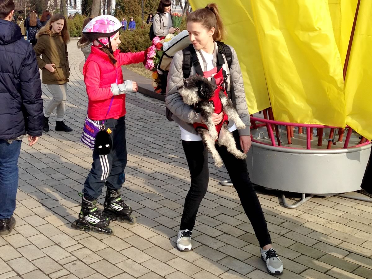 Mariya gives out flowers in Kyiv